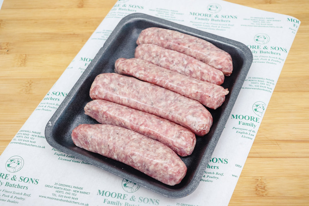 Six Lincolnshire Sausage on tray on top of a butchers block